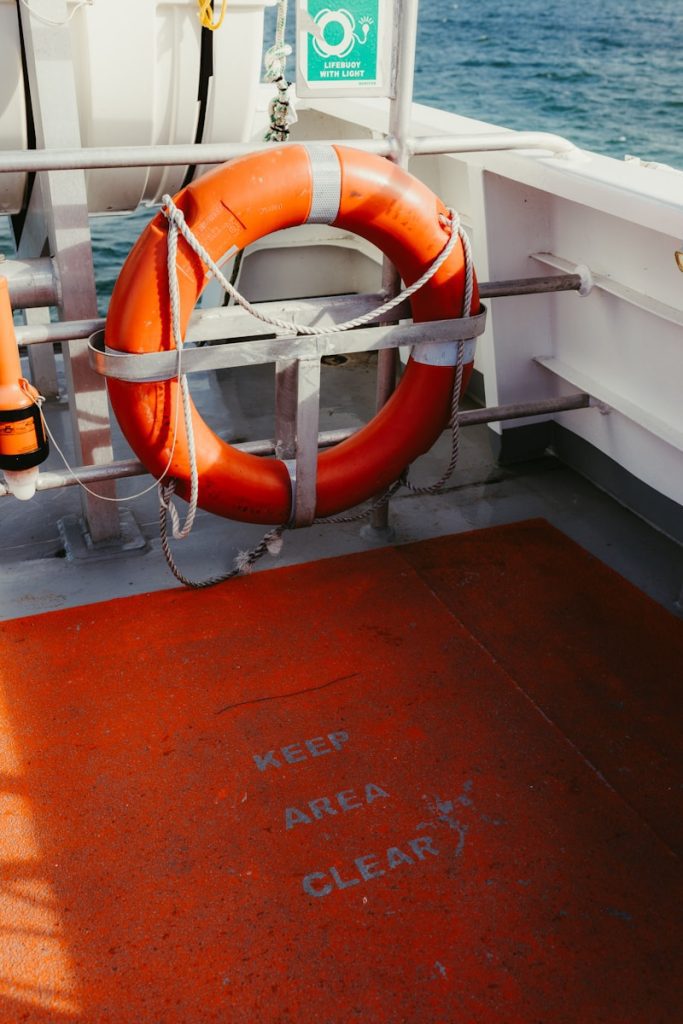 Orange life preserver on a boat deck